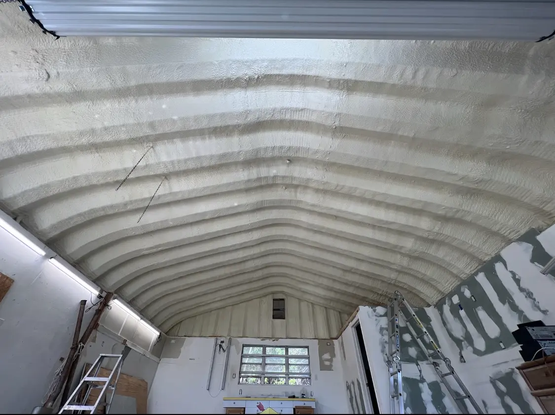 Spray polyurethane foam applied to the underside of a metal roof deck in London Grove